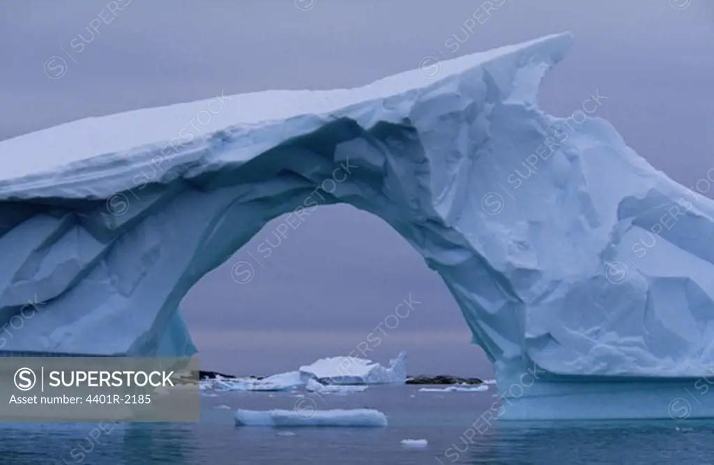 Arch shaped glacier in water