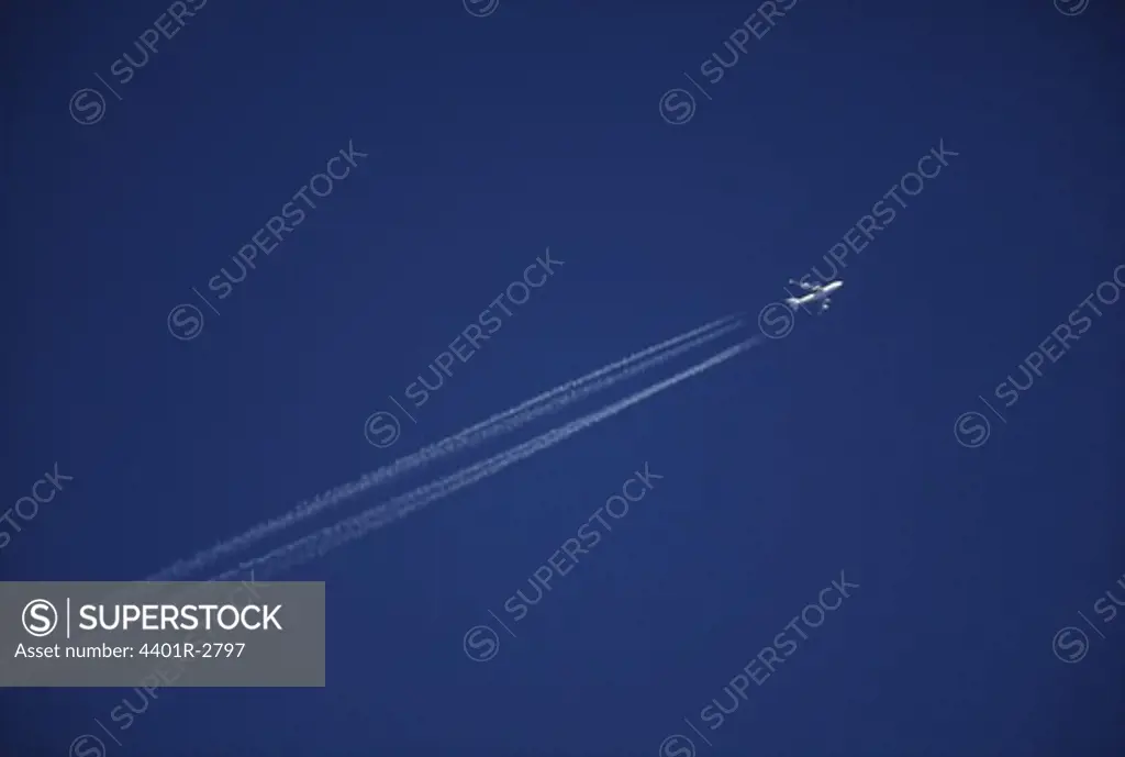 Airplane flying in sky, low angle view