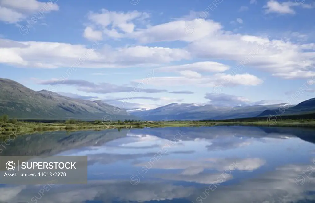 Lake with mountains in background