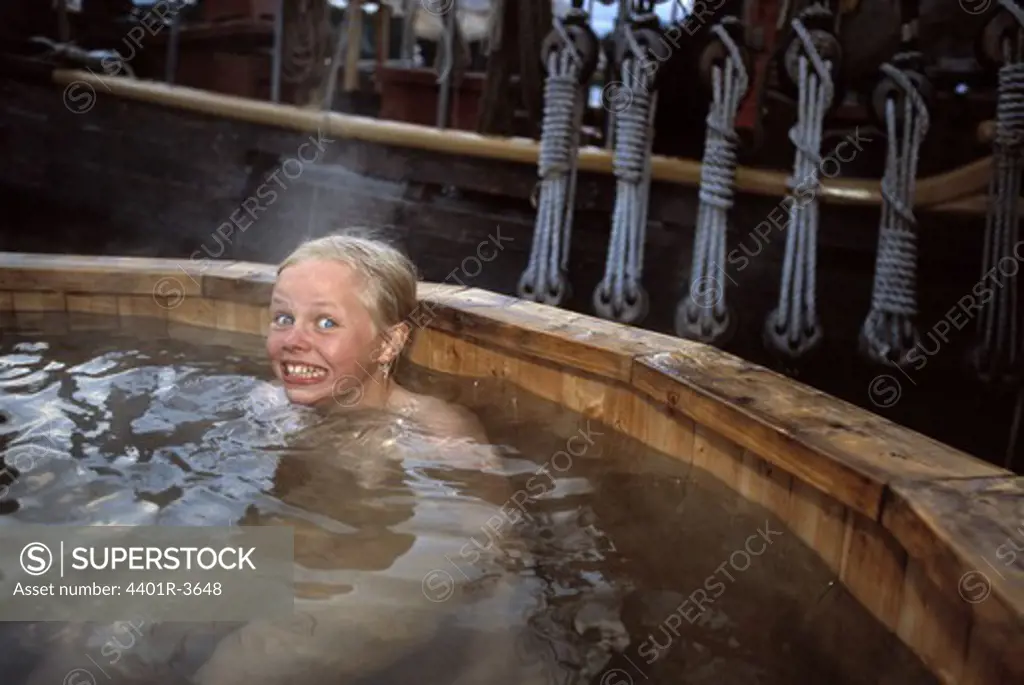 A girl in the hot tub of a ship, Sweden.