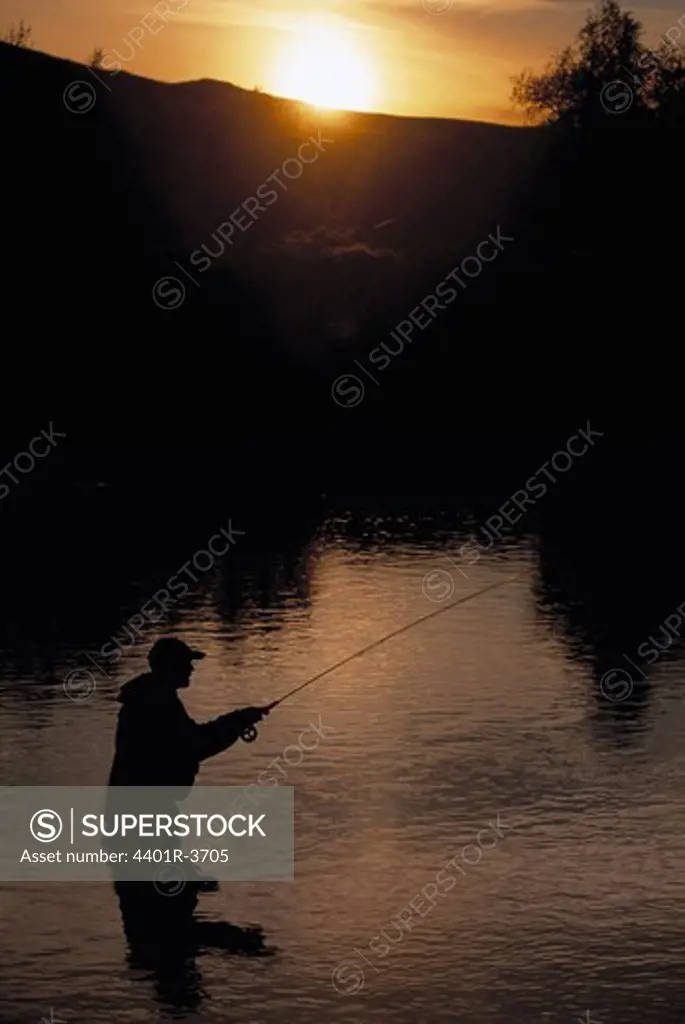 Fly fishing at midnight in July