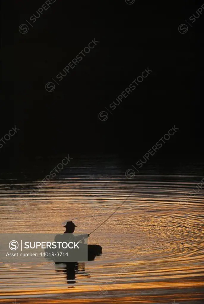 Fly fisherman in floating ring, fishing for Arctic Char