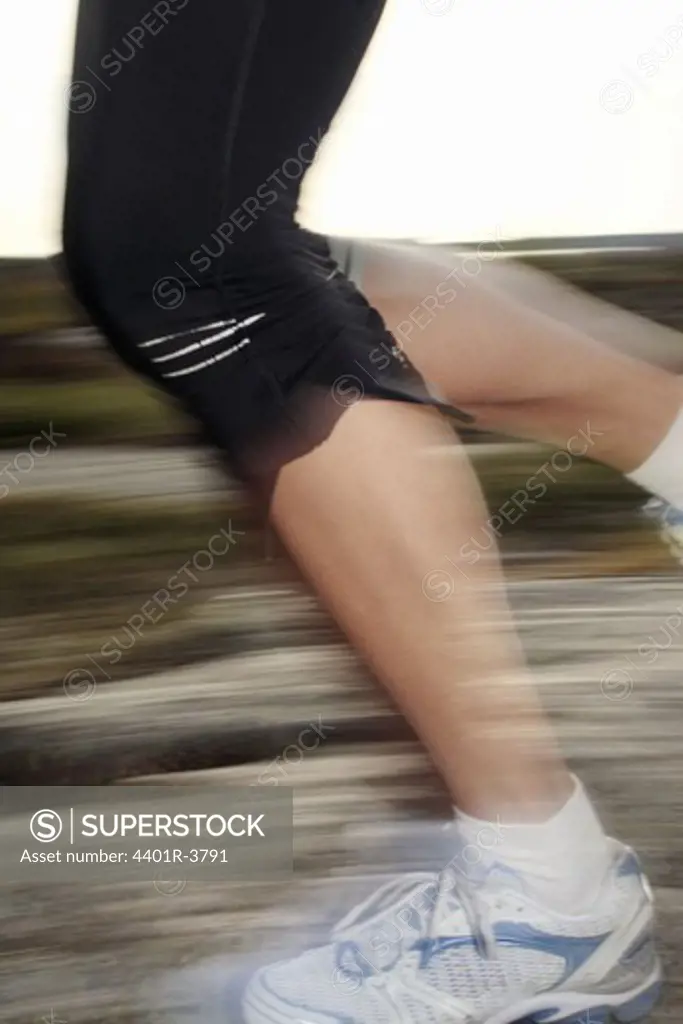 The legs of a woman yogging, Sweden.