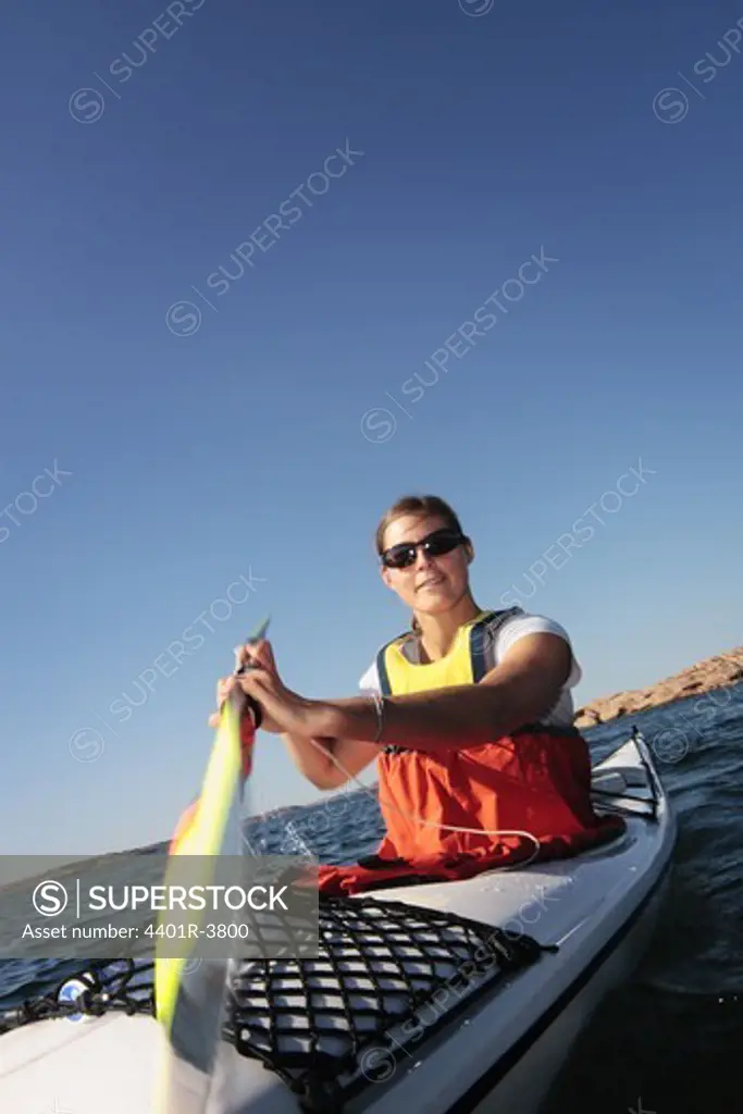 A woman in a kayak, Sweden.
