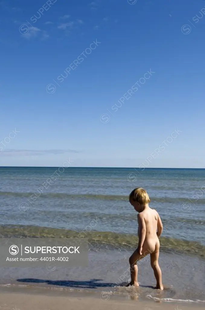 A little boy in the water, Sweden.