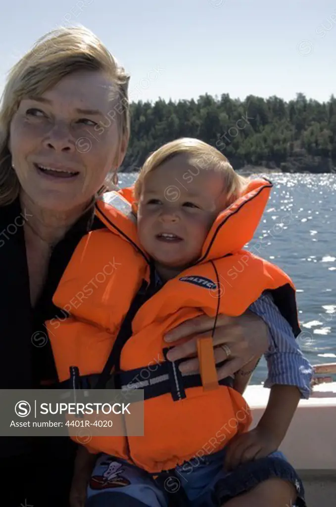 Grandmother and child by the water, Sweden.