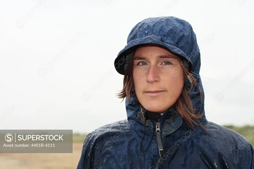 A woman wearing a raincoat, Halland, Sweden.