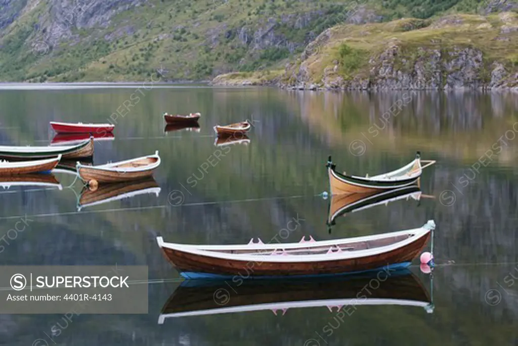 Rowing-boats in a calm sea, Lofoten, Norway.