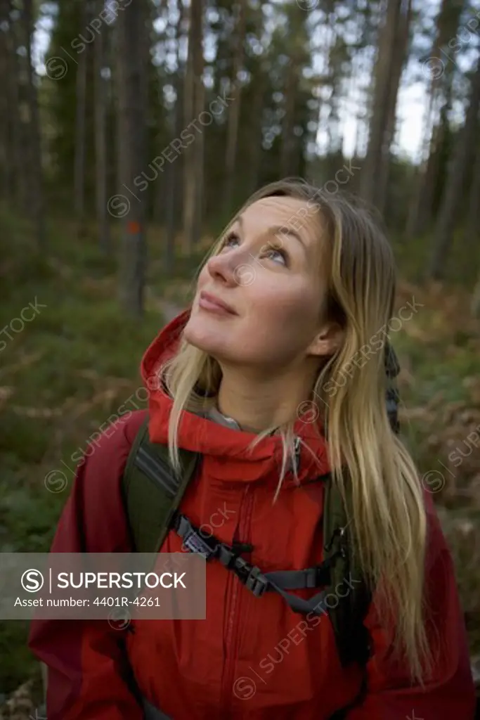 A woman walking in the forest, Sweden.