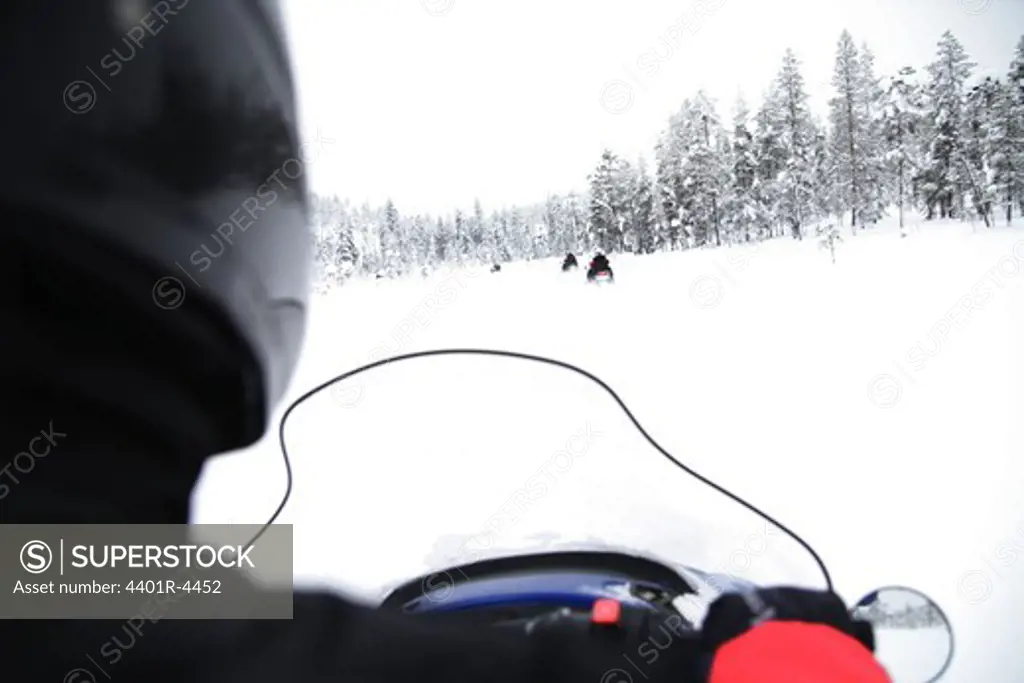 A person on a snowmobile, Sweden.