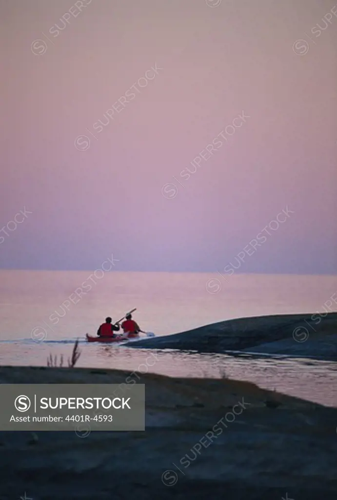 Two persons paddling in the archipelago.