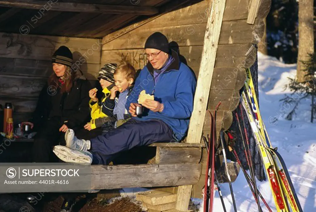 A family having a break during a ski trip, Sweden.