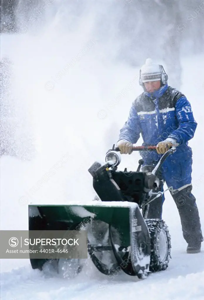 Clearing away snow with a snowblower, Sweden.