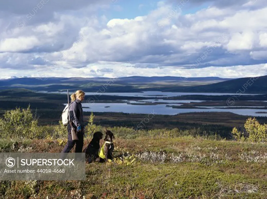 A hunter and a dogs, Kiruna, Lapland, Sweden.