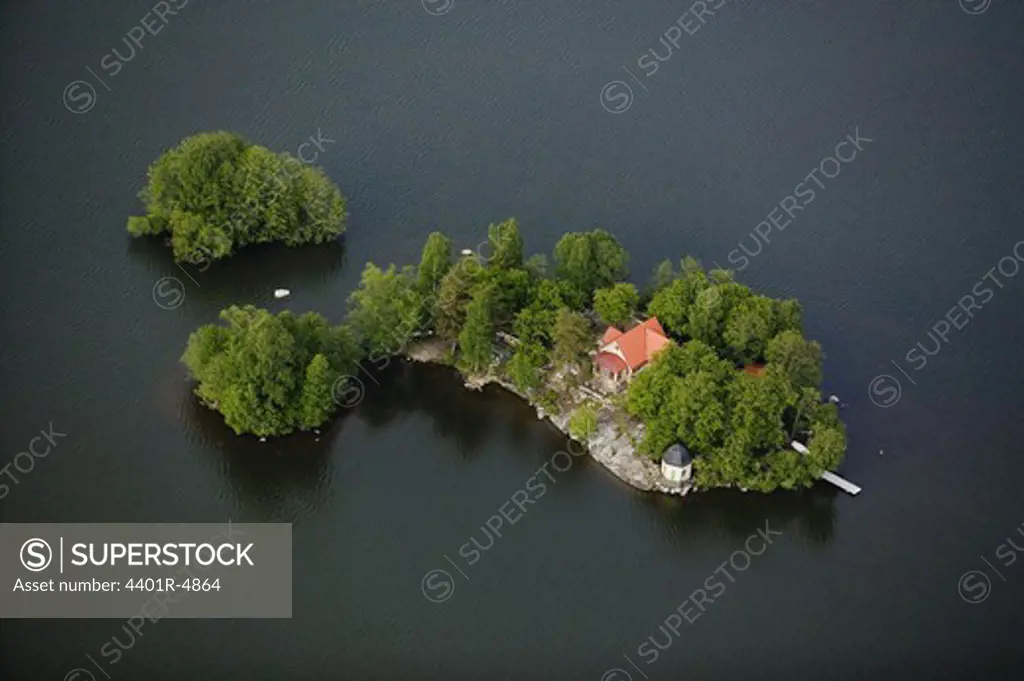 A house on an island in a lake, Sweden.