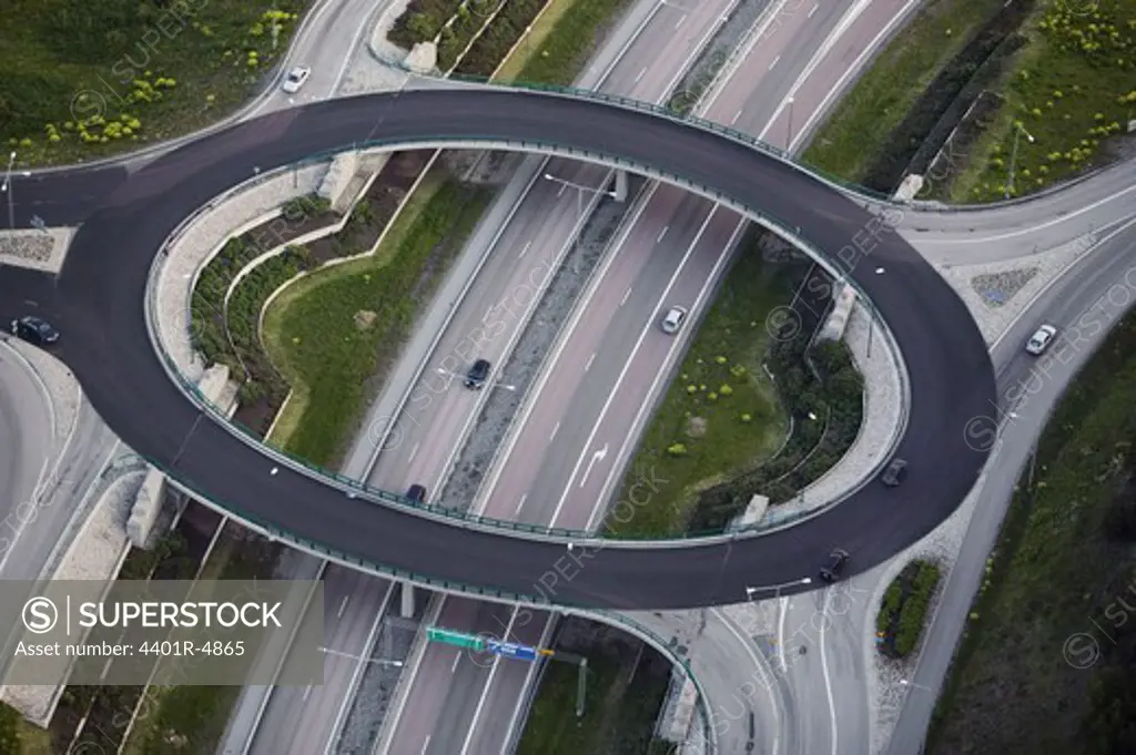 A roundabout above a motorway.