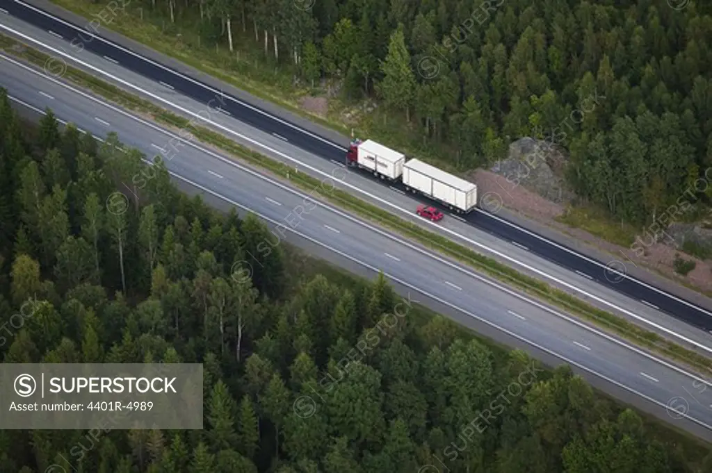 A lorry on a country road, Ostergotland, Sweden.