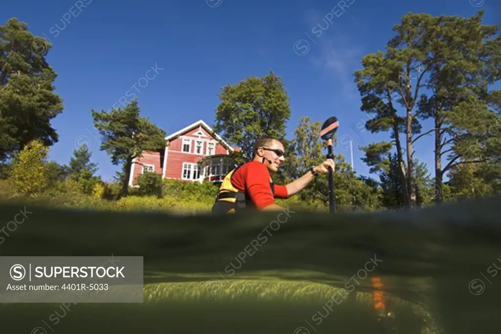 A man in a kayak, Sweden.