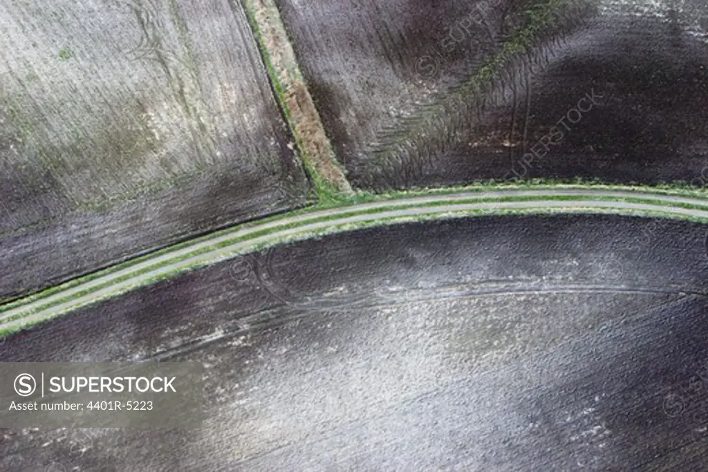 Gravelled roads in agricultural district, aerial view, Skane.