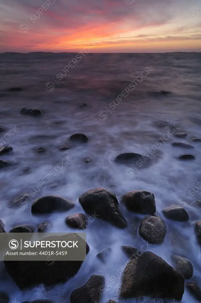 Stones in moving water, Halland, Sweden.