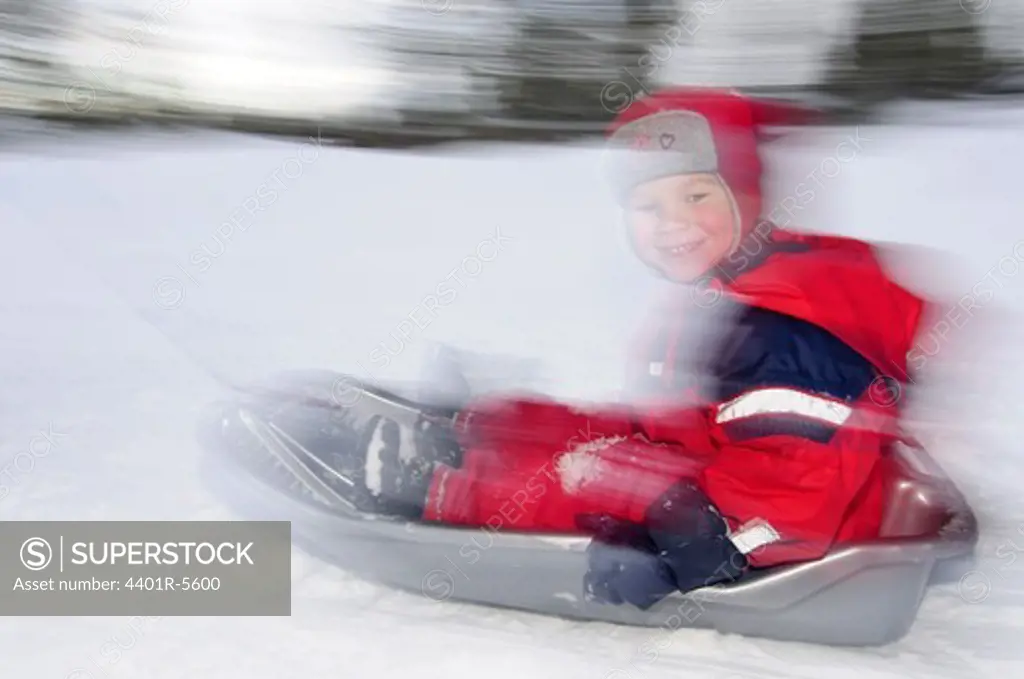 A child in a little sledge, Harjedalen, Sweden.