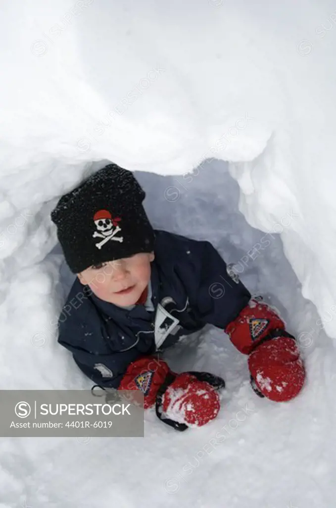 A boy playing in the snow, Sweden.