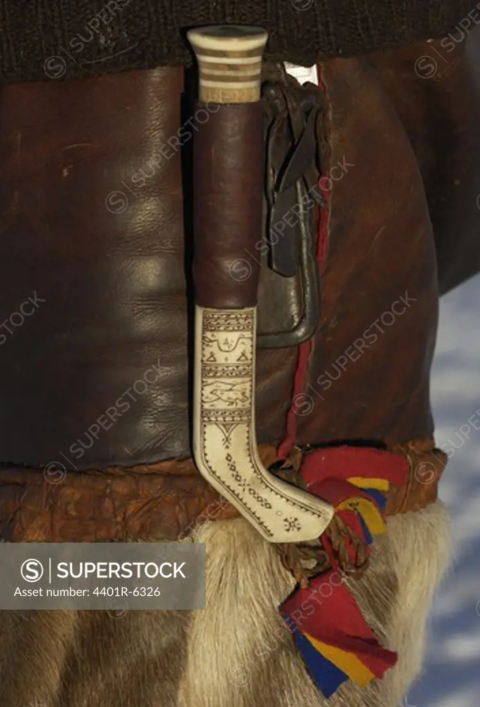 Reindeer herdsman, with reindeer skin trousers and a home-made Saami knife.