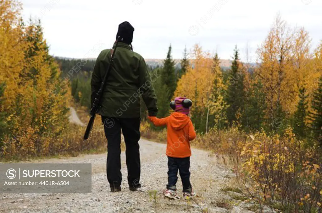 A woman and a child hunting, Sweden.