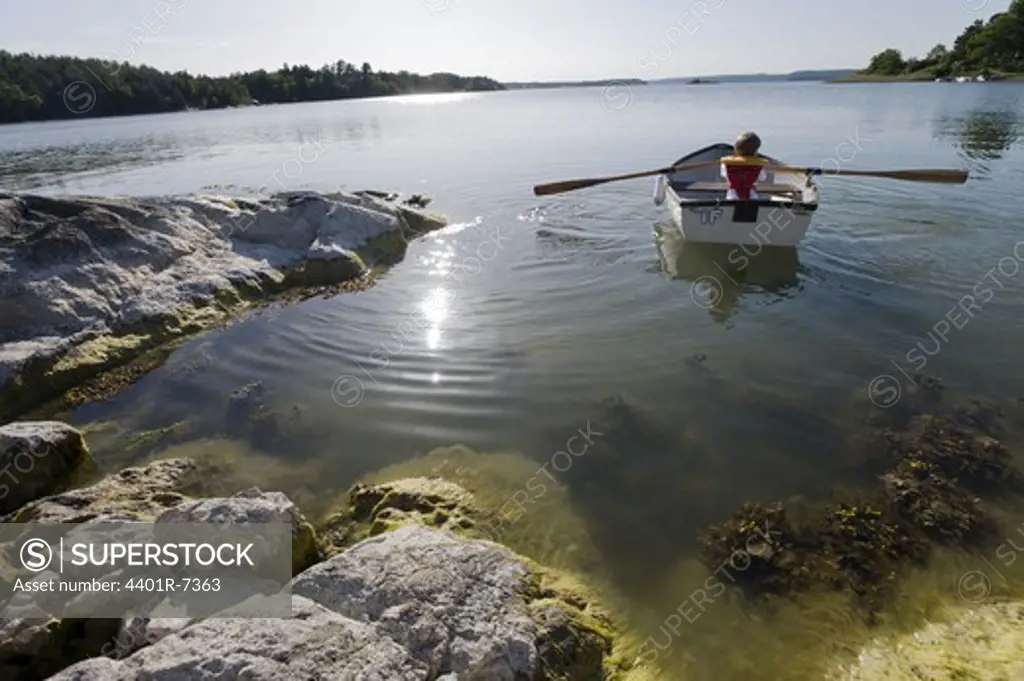 A boy rowing, the Baltic Sea, Sweden.