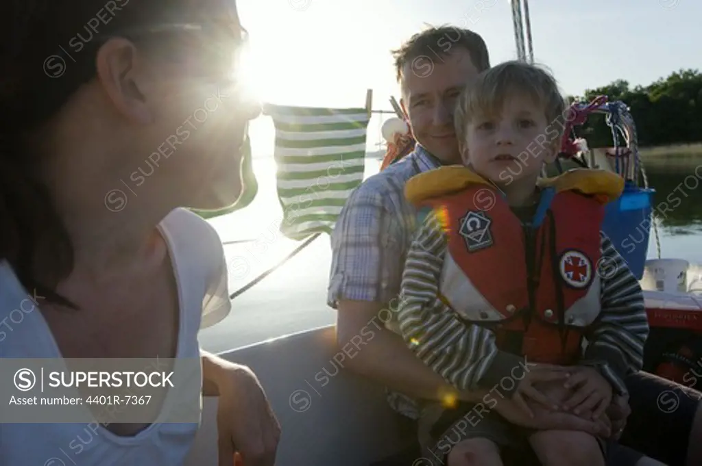 A family on a sailing-boat, Sweden.