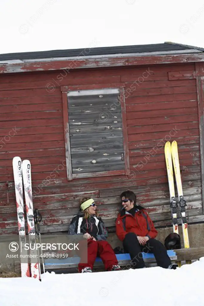 Smiling skiers having a break, Lapland, Sweden.