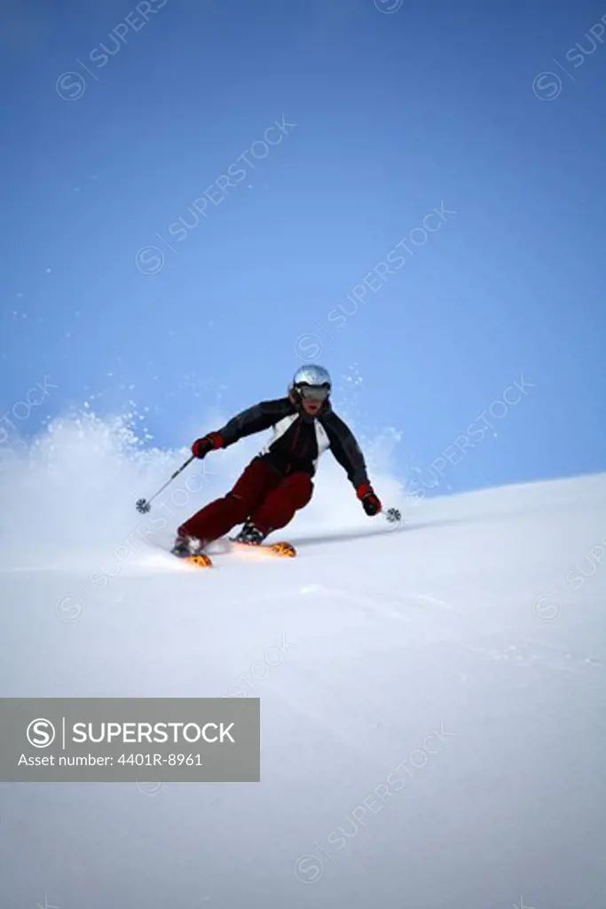 Skier going downhill, Abisko, Lapland, Sweden.