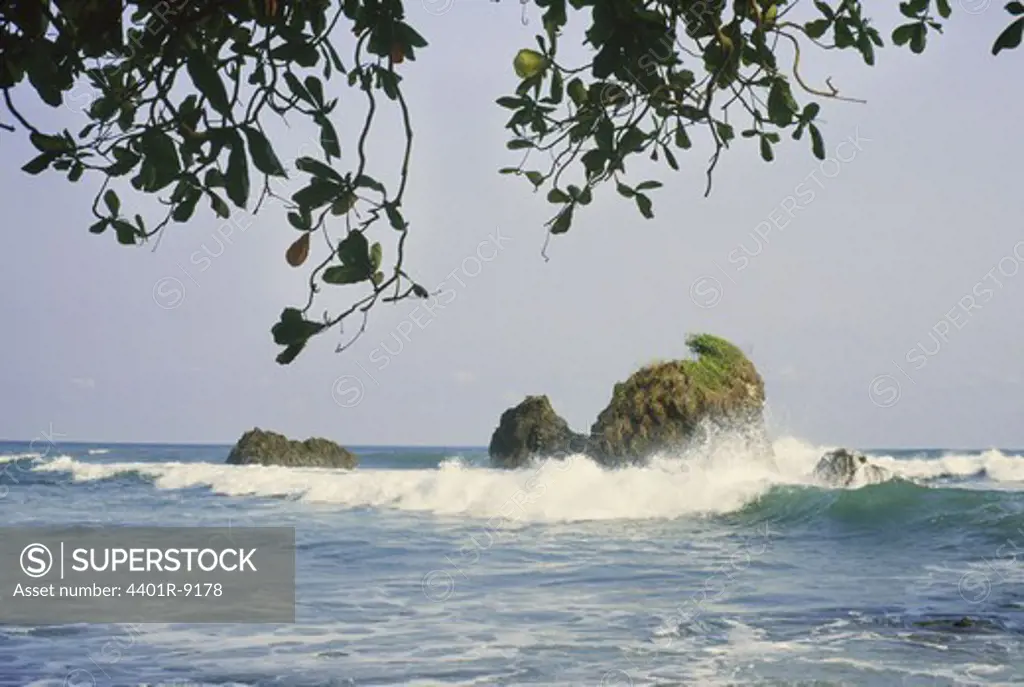 View of waves crashing against rock