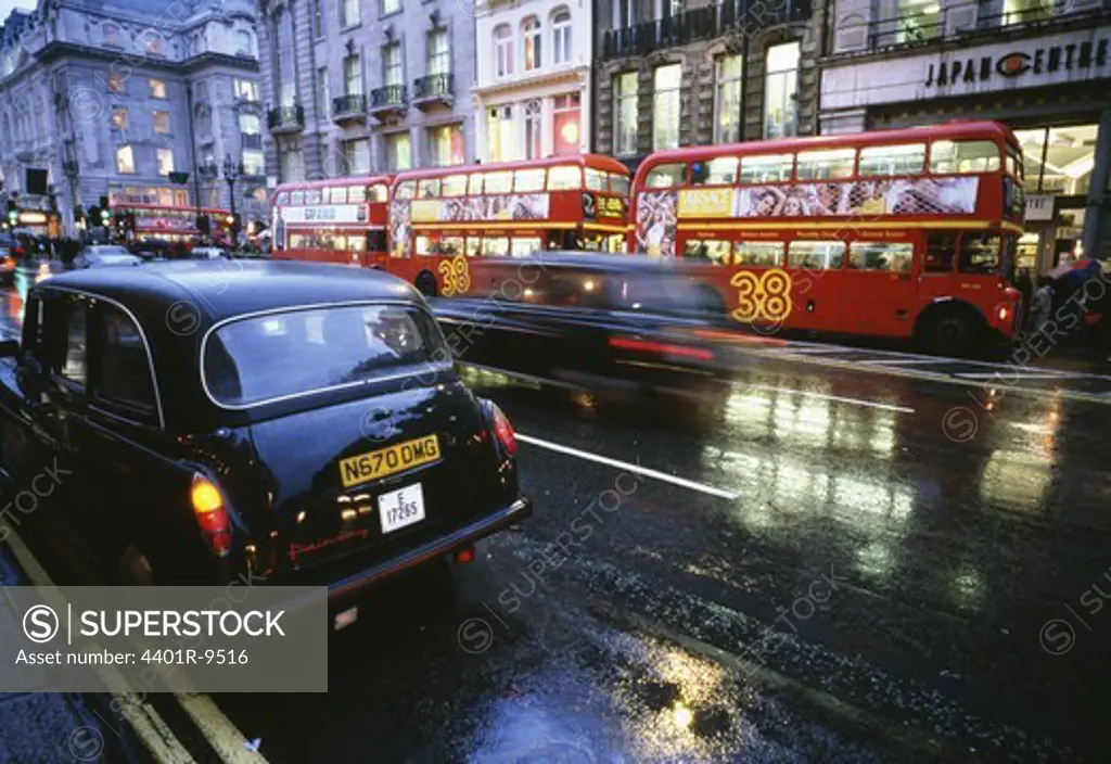 Buses and taxis a rainy day in London, Great Britain.