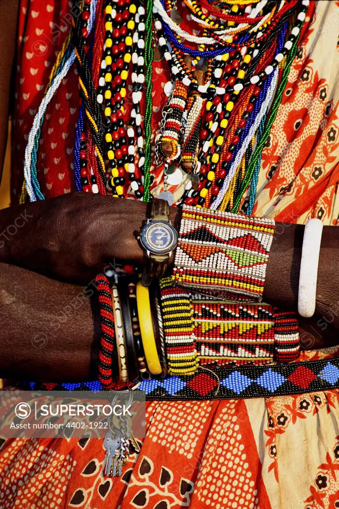 Maasai man in traditional dress wearing watch, Kenya
