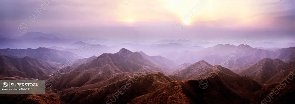 Sunset in mountians through which the Great Wall of China runs, near Beijing, China