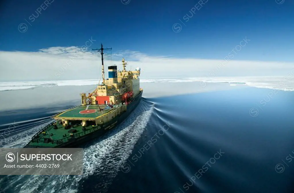 Icebreaker sailing toward ice floes, Antarctica