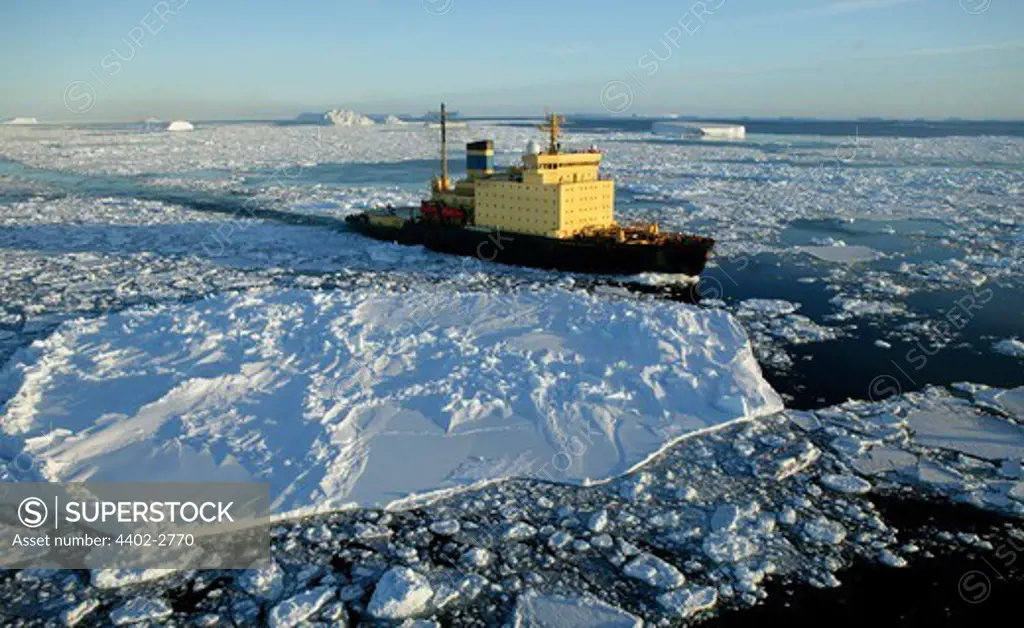 Icebreaker churning through ice floes, Antarctica