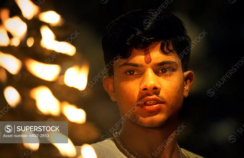 Hindu holy man performing religious ceremony (puja), Varanasi, India