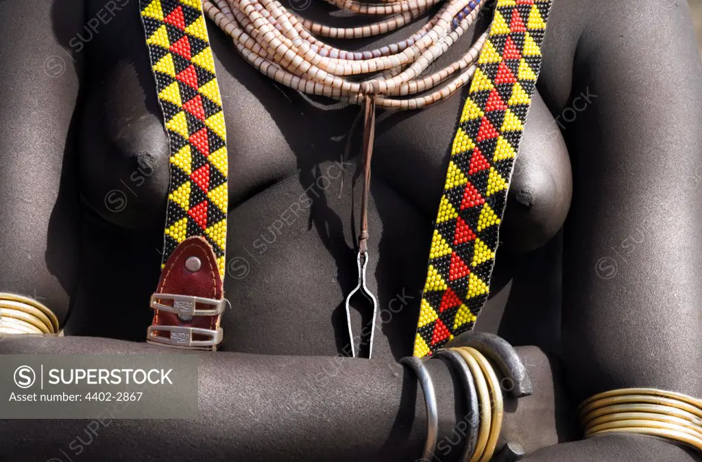 Torso of Karo tribeswoman decorated with beads and a beaded belt, Omo Delta, Ethiopia, Africa.