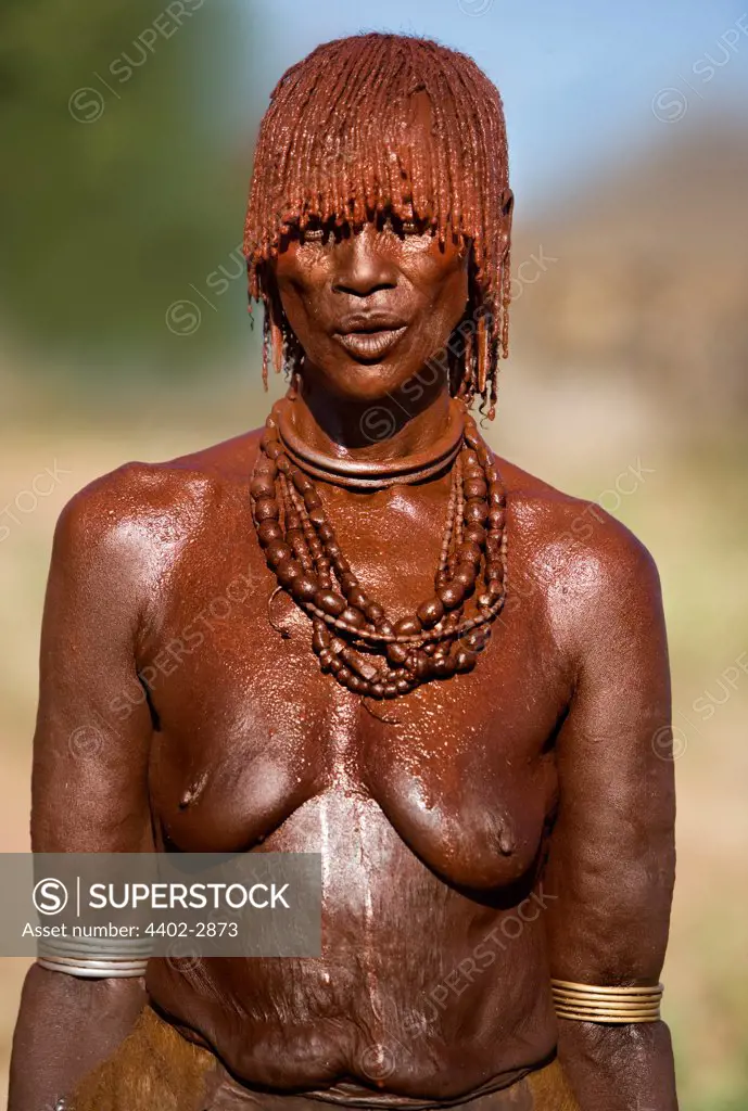 Hamar tribeswoman decorated with paste made from ochre and animal fat. Omo Delta, Ethiopia, Africa