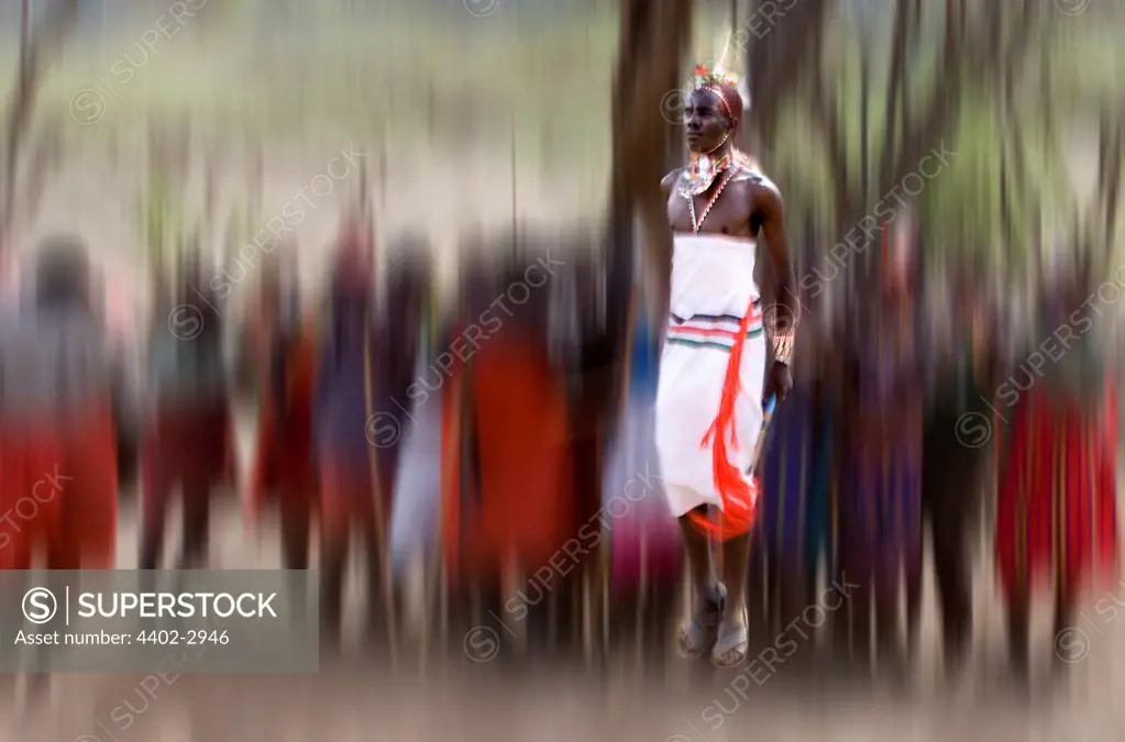 Samburu tribesman dancing to celebrate the mass circumcision of the young men of the tribe, Mount Nyiru, Kenya, Africa