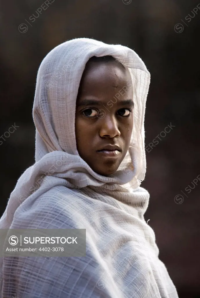 Young woman attending church, Lalibela, Ethiopia, Africa.