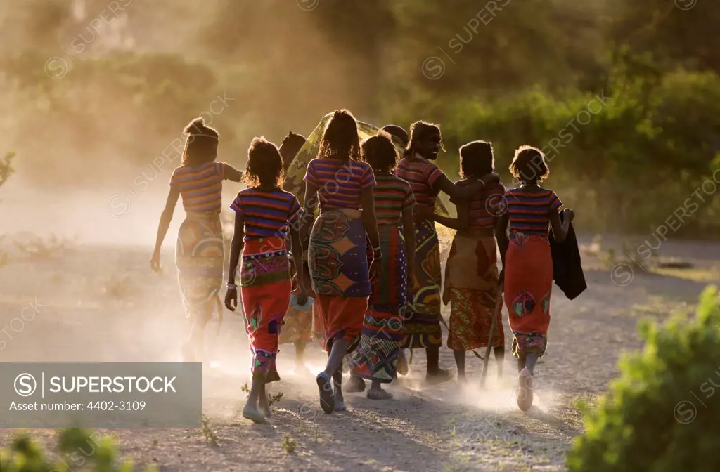 Afar girls on their way to join evening dancing, Ethiopia