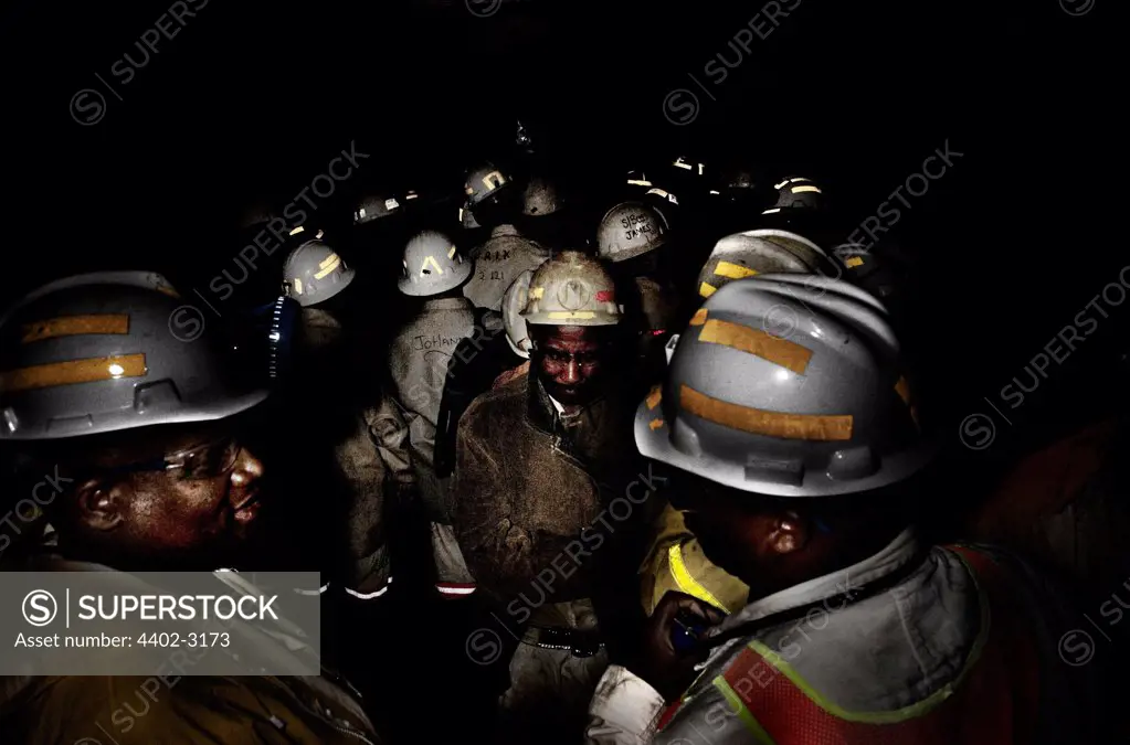 Gold miners in cage lift plunging 3km to work underground, near Johannesburg, South Africa