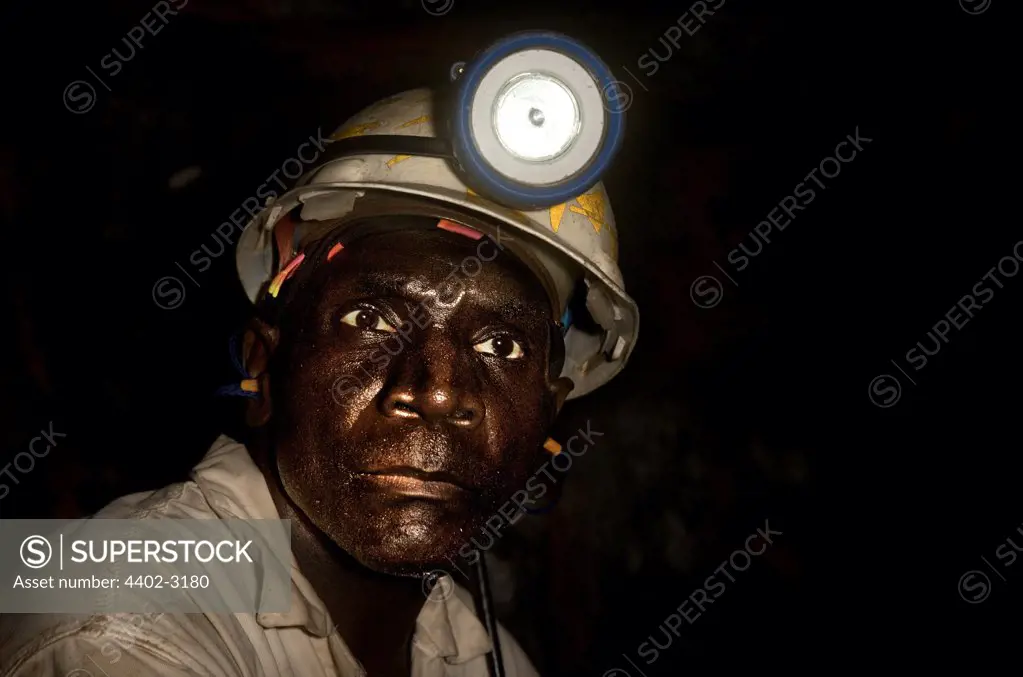 Gold miner working deep underground, near Johannesburg, South Africa