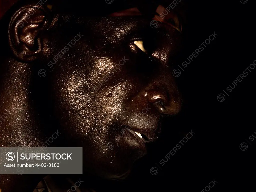 Gold miner working deep underground, near Johannesburg, South Africa