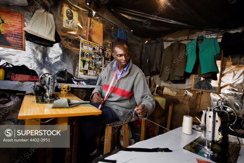 Jared Duma working in the Hope Tailoring Shop, Nairobi, Kenya.