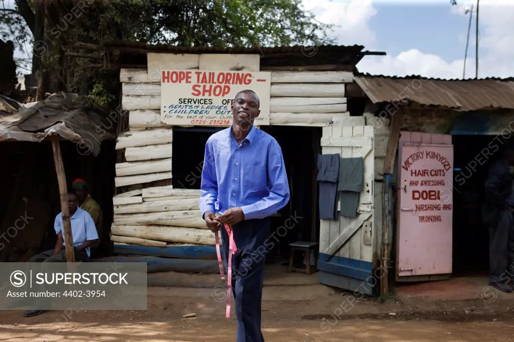 Jared Duma outside the Hope Tailoring Shop, Nairobi, Kenya.