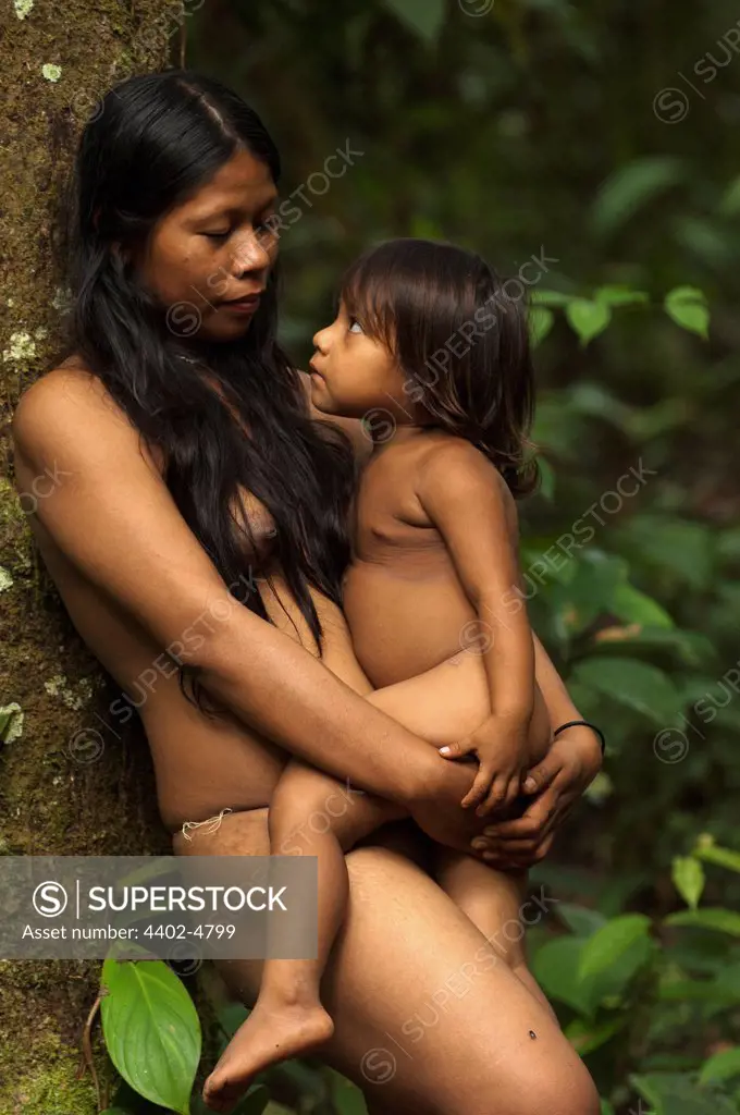 Huaorani Indian women & child, Norma & Romelia Kaiga. Gabaro Community, Yasuni National Park, Amazon rainforest, Ecuador, South America.